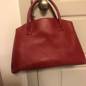 Red leather handbag